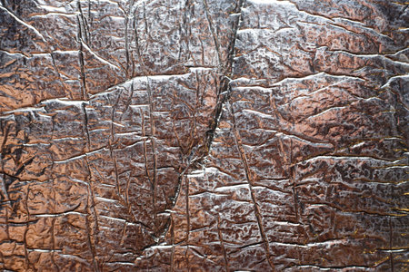 Shiny silver wrinkled foil background texture