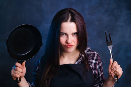 Emotions, culinary, love cooking concept. Young attractive houseの写真素材