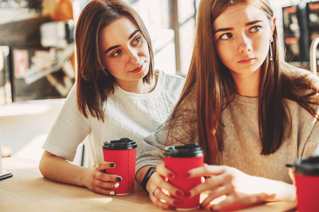 Woman trying to comfort her sad friendの写真素材