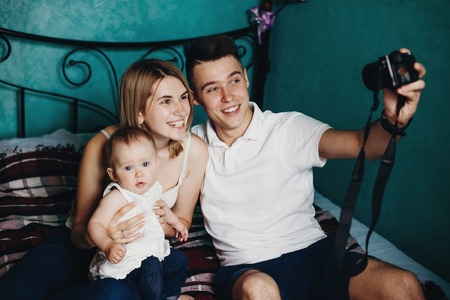 Daddy taking pictures of his family.の写真素材