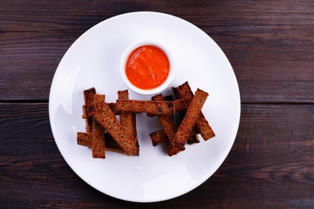 Rye bread toasts with tomato sauceの写真素材