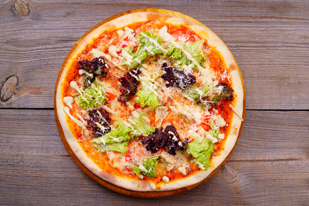 Vegetarian pizza with garlic sauce ans lettuceの写真素材
