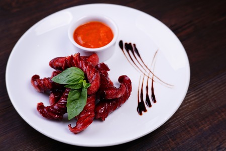 Roasted sausages and tomato sauce, beer snackの写真素材