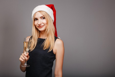 happy young woman celebrating drinking champagneの写真素材