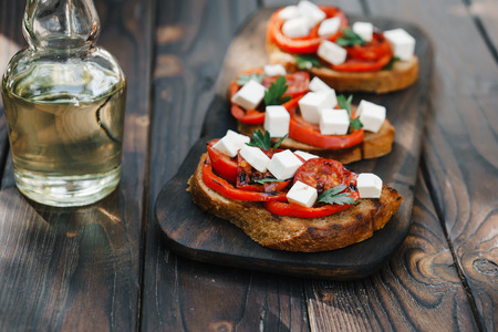 crostini with grilled tomatoes and feta cheeseの写真素材