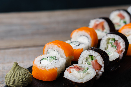 Japanese sushi rolls with salmon, food backgroundの写真素材