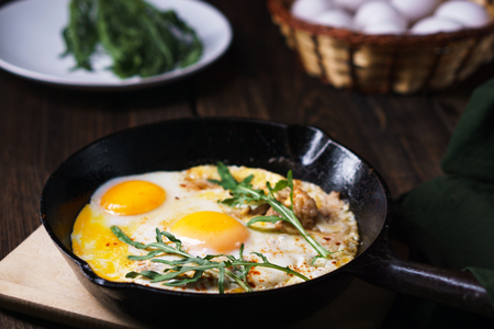 Low carb food, eggs with bacon and arugulaの写真素材