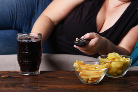 Overeating, sedentary lifestyle, alcohol addictionの写真素材