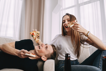 Party, friendship, food delivery, people eat pizzaの写真素材