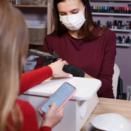 professional manicure procedure at beauty salonの写真素材