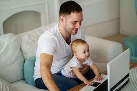 Father and son watching video or playing game