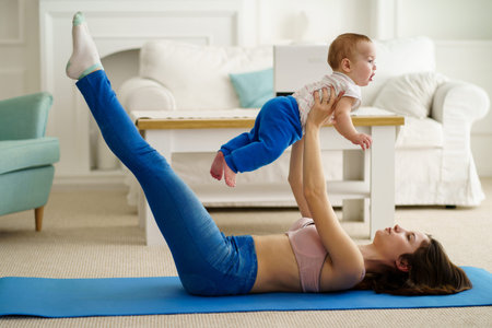Mother training at home together with baby son