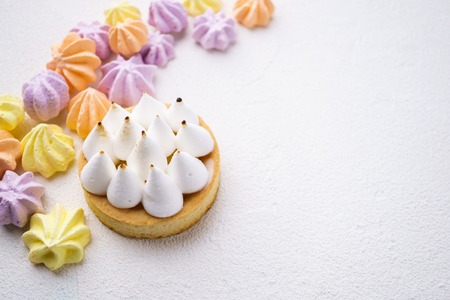 Candy  with lemon tart and meringuesの写真素材