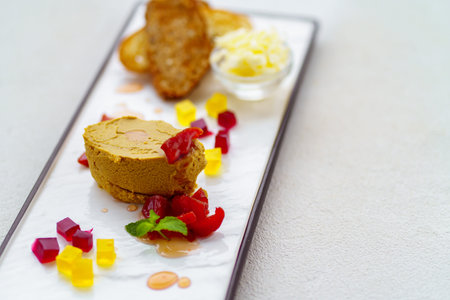 Chicken liver pate served with butter and toasts