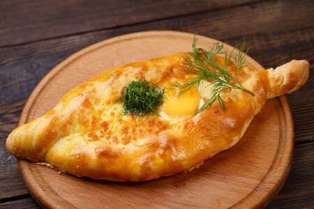 Ajarian khachapuri on wooden table close upの写真素材