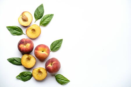 Creative summertime fruit layout made of peachesの写真素材