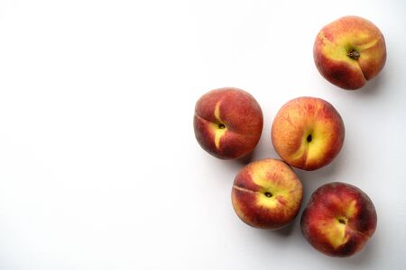 Summer background of ripe sweet peaches on blueの写真素材