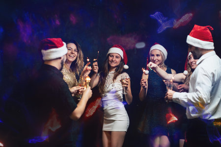 Friends celebrating dancing on Christmas party
