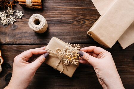 Woman preparing Christmas gifts. Present packagingの写真素材