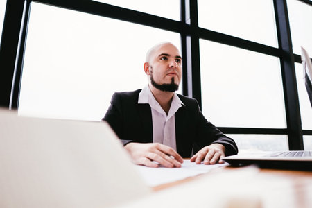 Young ambitious businessman at office