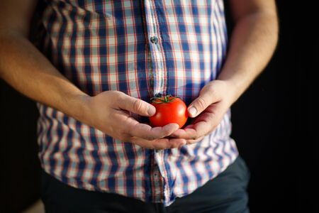 Obesity prevention, conscious eating, nutrition choices, mindfulness and healthy lifestyle. Cropped portrait of overweight man with vegetablesの写真素材