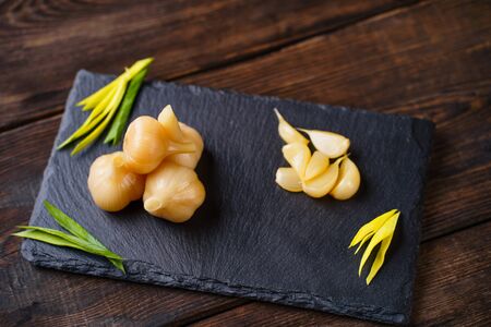 Pickled garlic. Preserved food, tasty snackの写真素材