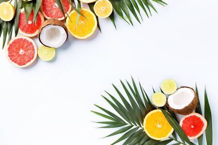 Summertime tropical background with exotic fruitsの写真素材