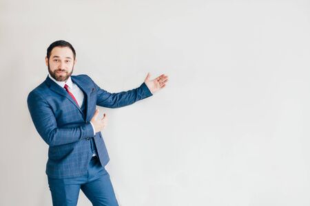 Young businessman in modern office, copy spaceの写真素材