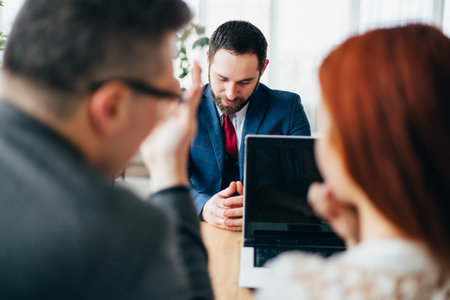 Recruiters checking male candidate, job interview