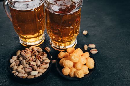 beer and snacks. lager drink and salted nutsの写真素材