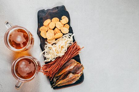 light beer and set of delicious seafood snacksの写真素材