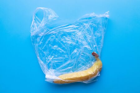 Plastic pollution, fresh banana in plastic bagの写真素材