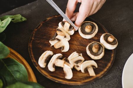 Closeup portrait of woman cooking healthy dinnerの写真素材