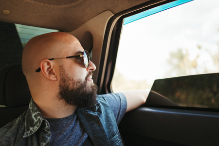 Young man traveling by carの写真素材