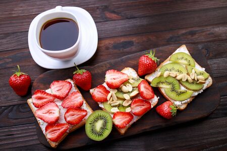 Healthy breakfast, sweet fruit toasts and coffeeの写真素材