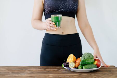 Fit woman with green detox smoothieの写真素材