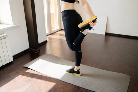 Woman doing stretching exercise warming up muscles