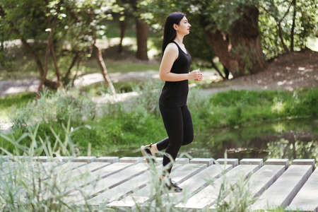 Active woman jogging in the park. Sport, fitnessの写真素材