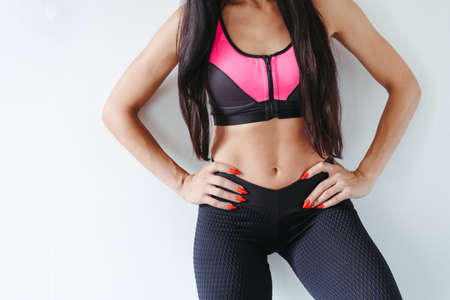 Fit woman with perfect muscular body in activewearの写真素材