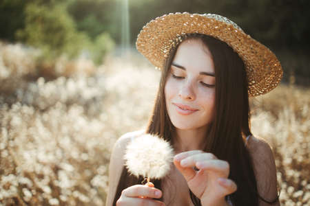 Beautiful woman enjoy walking on summer meadowの写真素材