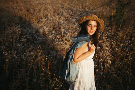 Carefree woman walking alone in summer nature