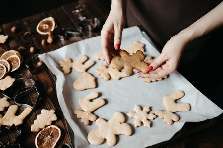 Woman hands with homemade gingerbread cookies