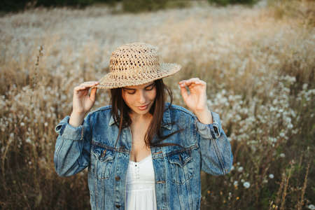 Young beautiful woman enjoy free time on summer meadowの写真素材