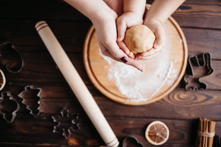 Mother and daughter cooking Christmas sweets