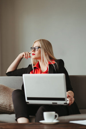 Remote work. Young woman working from home online using laptop. Distance learning, isolation,...