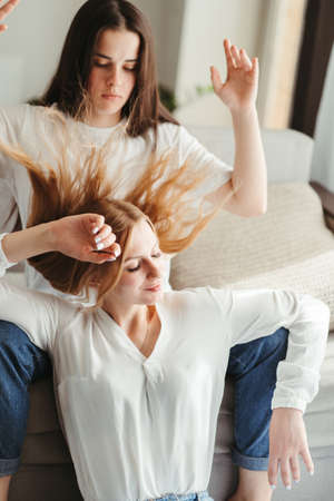 Happiness, equality, human relationships. Romantic moments. Lgbt couple. Happy playful girlfriends in love sharing time together indoorsの写真素材