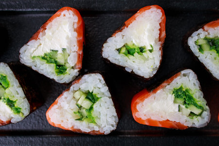 Seafood delicatessen salmon sushi rolls on plate. Gourmet snacks. Luxury lifestyle, Japanese food...