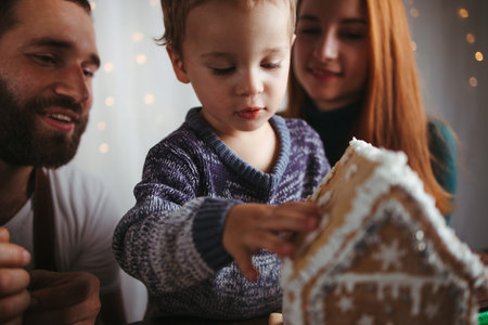 Christmas and New Year celebration. Family time. Holidays. Mother, father and son decorating...