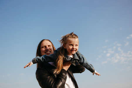 Dad and daughter. Fatherhood, family concept. Loving father having fun spending time with his little daughterの写真素材