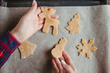 Christmas and New Year holidays preparation. Woman baking christmas gingerbread cookies.